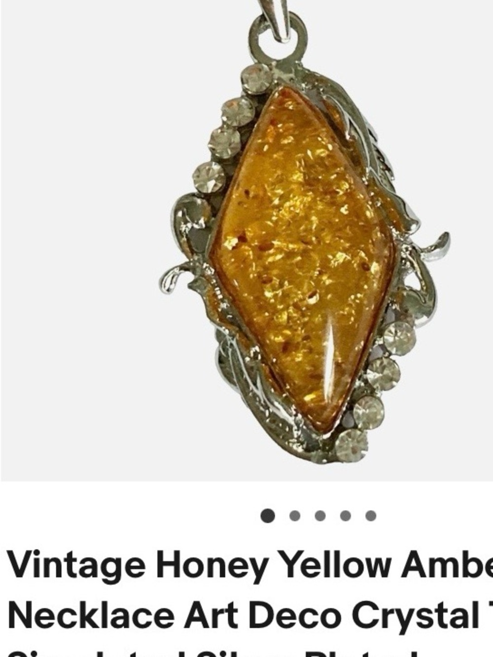 AMBER PENDANT IN SILVER-PLATED SETTING  2” long.